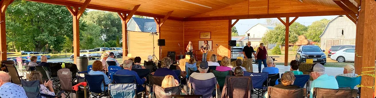 A music festival in progress under the Pavilion